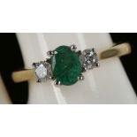 An 18ct yellow gold, 3 stone emerald and diamond ring, emerald: 0.59ct, diamond: 0.29ct