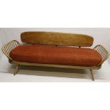 A MID 20th CENTURY ERCOL SOFA DAY BED, in elm and beech wood with swab seat and cushioned back, (206