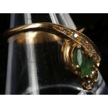 An 18ct gold, emerald and diamond set ring