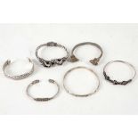 Six various .925 silver bracelets / bangles including hinged rams head cross-over, Mexican sun