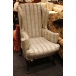 A small George I style wing armchair, upholstered