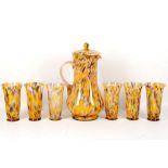 A mottled glass water set, comprising six flared glasses and a lidded baluster water jug (7)