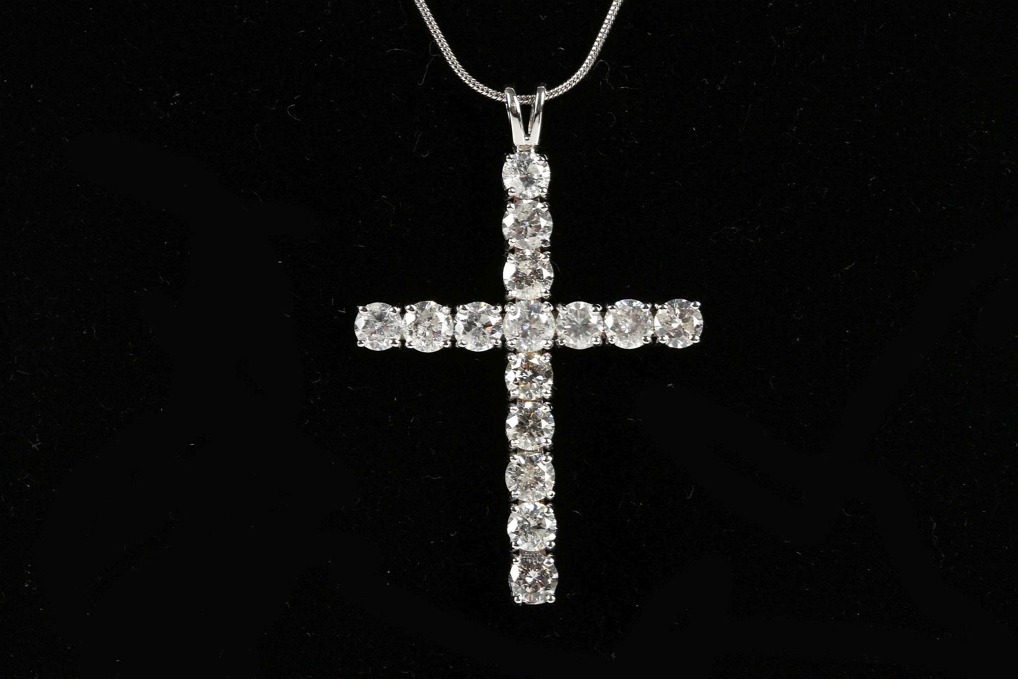 An 18ct white gold large diamond cross, 3.80ct on 18ct white gold snake chain