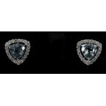 An 18ct white gold pair of trilion cut aquamarine and diamond earrings, stud fittings, aqua 2.