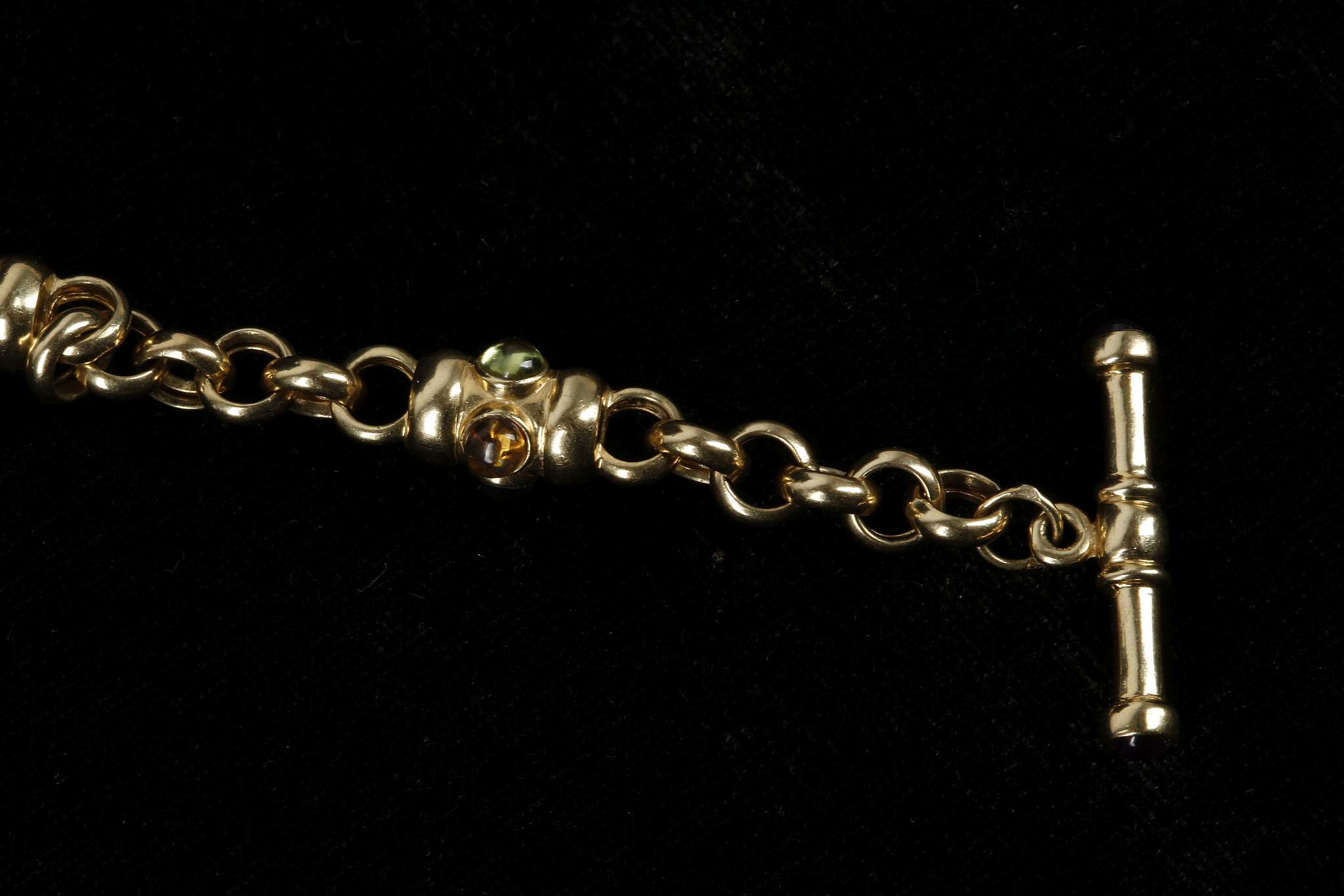 An 18ct gold fancy link bracelet, set with cabouchon garnets, citrine, topaz and peridot - Image 3 of 3