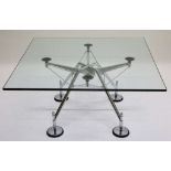 A NOMOS COFFEE TABLE by NORMAN FOSTER for TECNO, glass top on chrome base, stamped with maker's