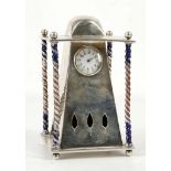 A continental, late 19th Century, silver mantle clock with enamelled barley twist pillars and