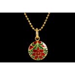An Indian 22ct gold and diamond set solitaire pendant with enamel decoration suspended from a 22ct