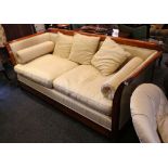 A modern, French, beechwood framed, two seater sofa, upholstered in yellow silk
