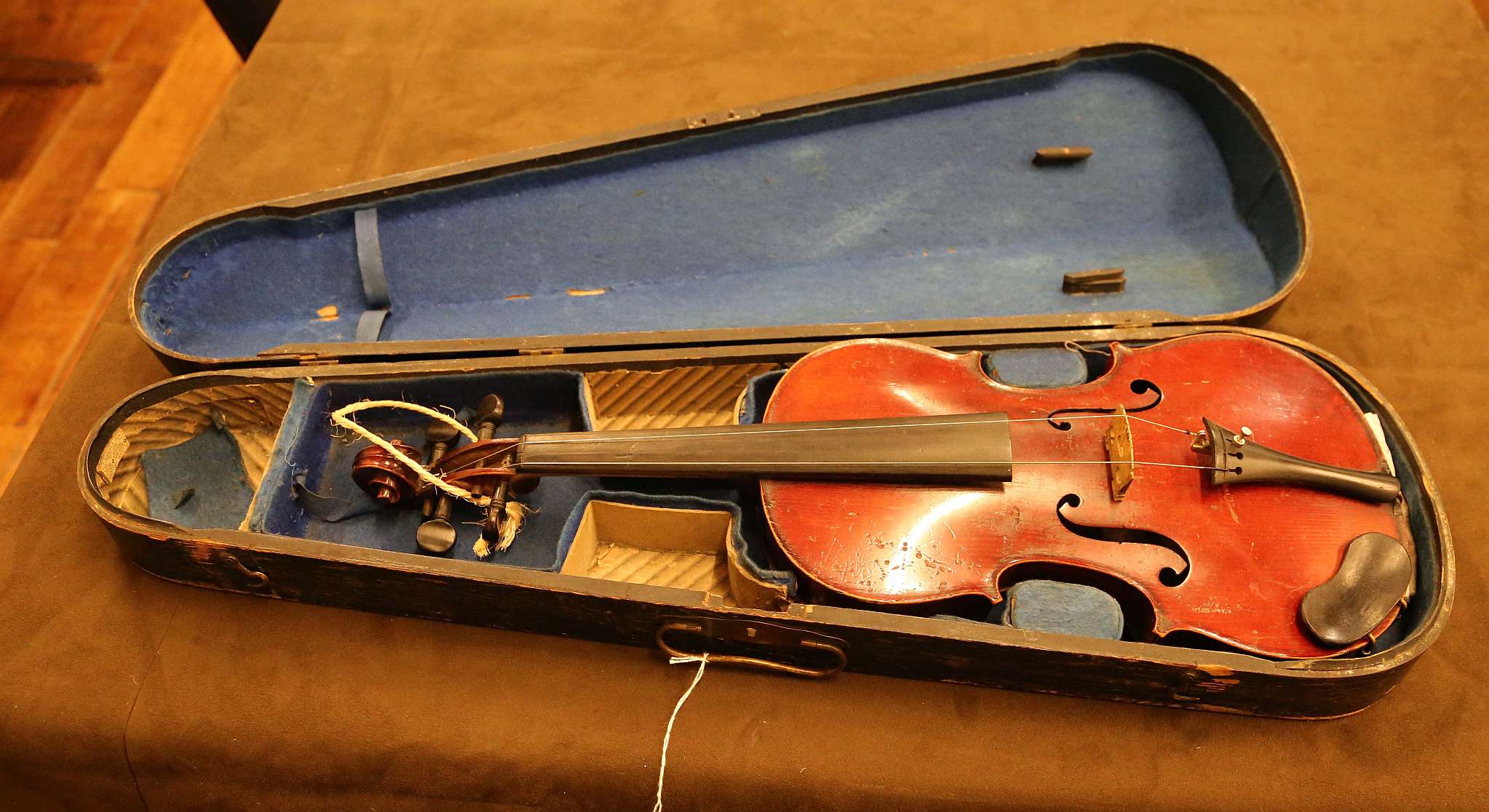 A burgundy medio-fino violin with one piece back with hard carry case, the back 35.7cm long not