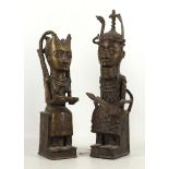 A pair of Benin bronze tribal figures, he with ceremonial knife, she with tray of kola nuts, 40cm