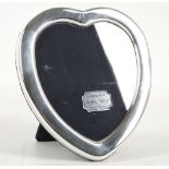 A fine quality heart shaped, hallmarked silver photograph frame, by Richard Carr - Sheffield 1988,