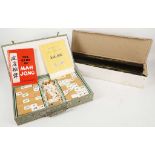 A Mahjong set with counters, bamboo backing and lacquered stands