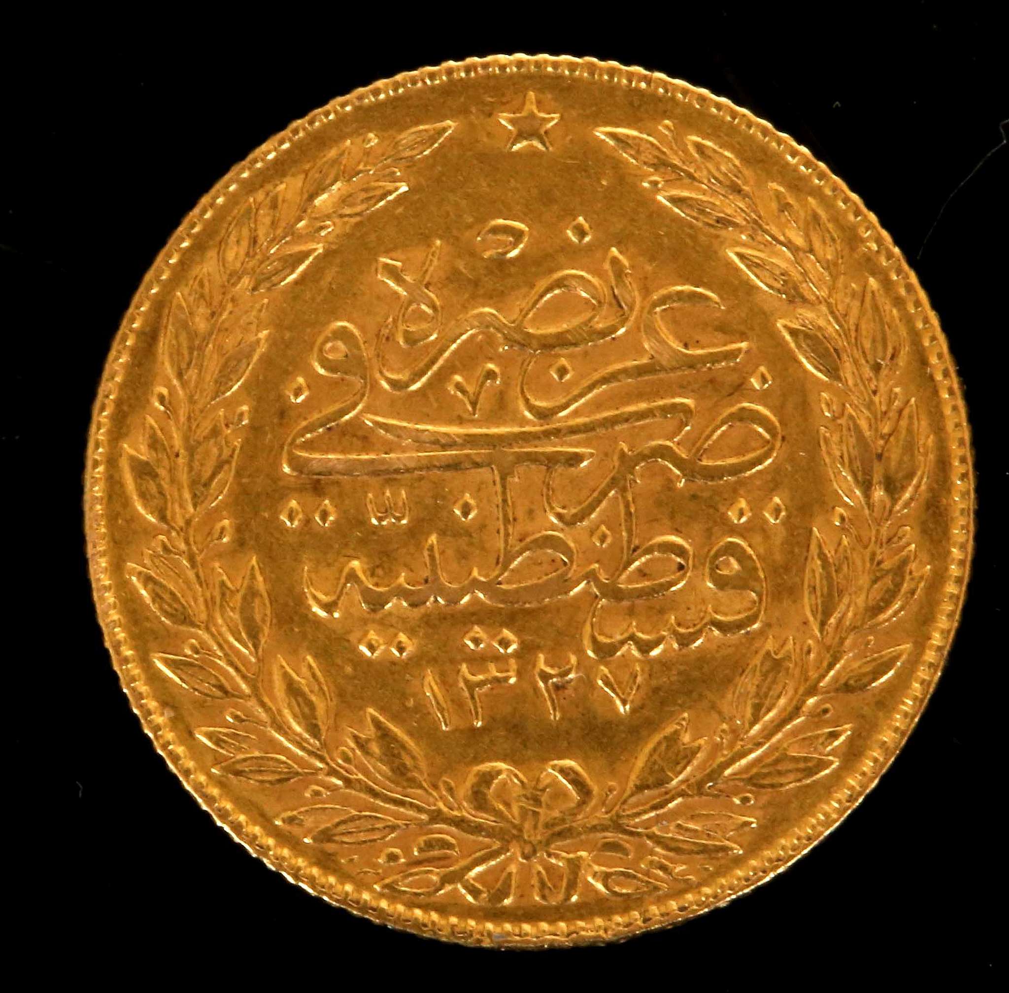 Turkey, a gold 100 Kurus coin 1867-70, obverse El-Ghazt at right of Toughra, reverse script within - Image 2 of 2