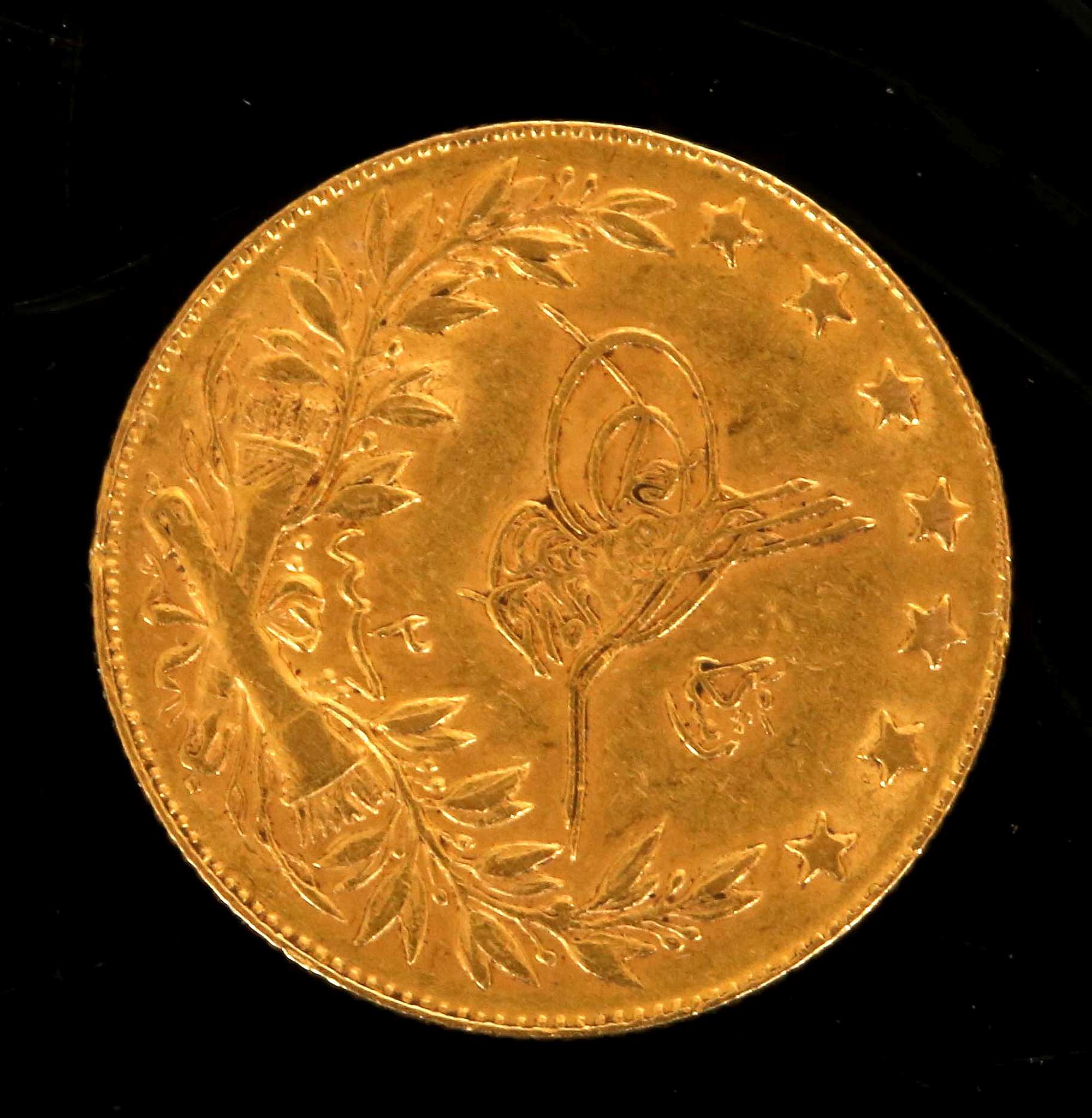 Turkey, a gold 100 Kurus coin 1867-70, obverse El-Ghazt at right of Toughra, reverse script within