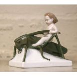 A Rosenthal figure of a boy on a grasshopper
