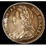 A George II half crown 1731, young head left, reverse with roses and plumes in angles, the beading
