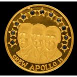 A gold .900 medallion commemorating the 1969 lunar landing by astronauts; Aldrin, Collins, and