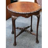 An Edwardian circular top occasional table, raised