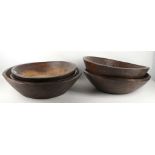 Five Indian rough hewn hardwood bowls, to include