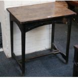 An Arts & Crafts oak table, pierced apron, 'spanne