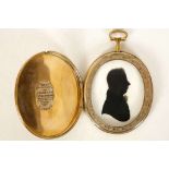 Miers, a gold cased locket with silhouette of gent