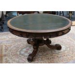 A late 19th Century oak drum table with green leat