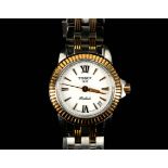 A ladies Tissot two tone metal wristwatch on integ