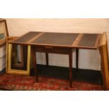 A 1920's draw leaf study table, mahogany with blac