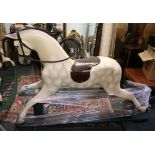 A Haddon grey rocking horse, Arab head, leather tr