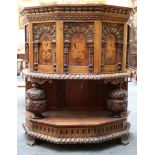 An oak 16th Century style credenza, with carved do
