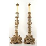 A pair of 19th Century, carved silvered wood candl
