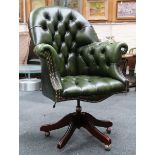 A green leather button, upholstered swivelling off