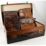 A leather suitcase, 61w x 36cm diameter, c.1920, a