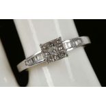 An 18ct white gold 9 stone, princess cut, diamond