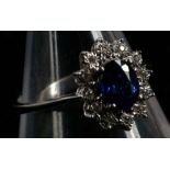 An 18ct white gold, sapphire and diamond cluster r