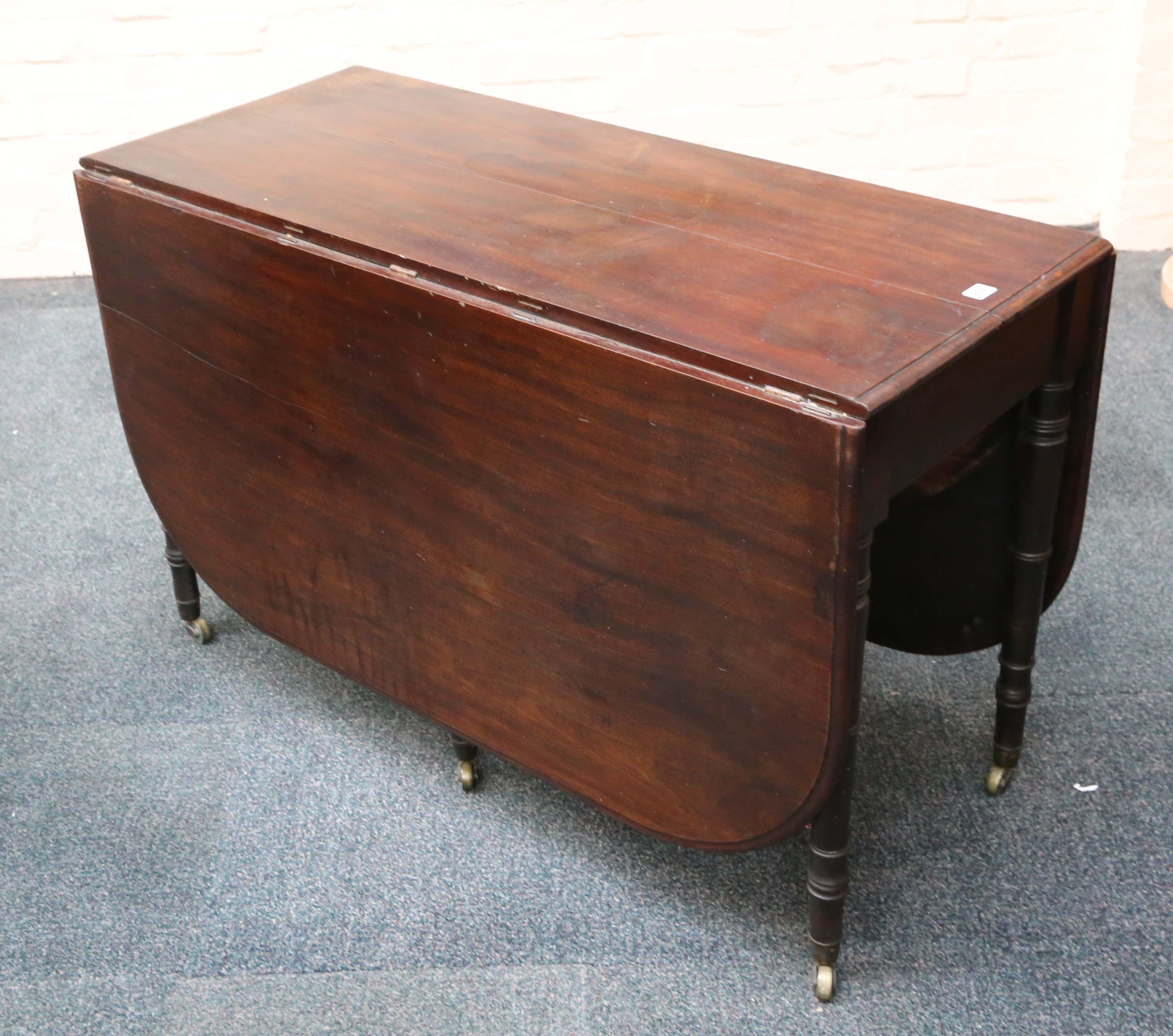 George IV Cuban mahogany drop leaf table, six ring