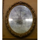 A 19th Century, giltwood oval wall mirror, the fra