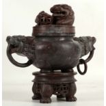 A Chinese stoneware carved incense burner, dog of