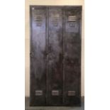 A steel set of three lockers