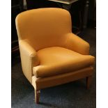 An upholstered tub chair, plain golden upholstery,