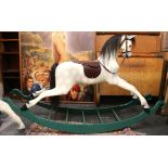 A Haddon grey rocking horse, small Arab head, leat