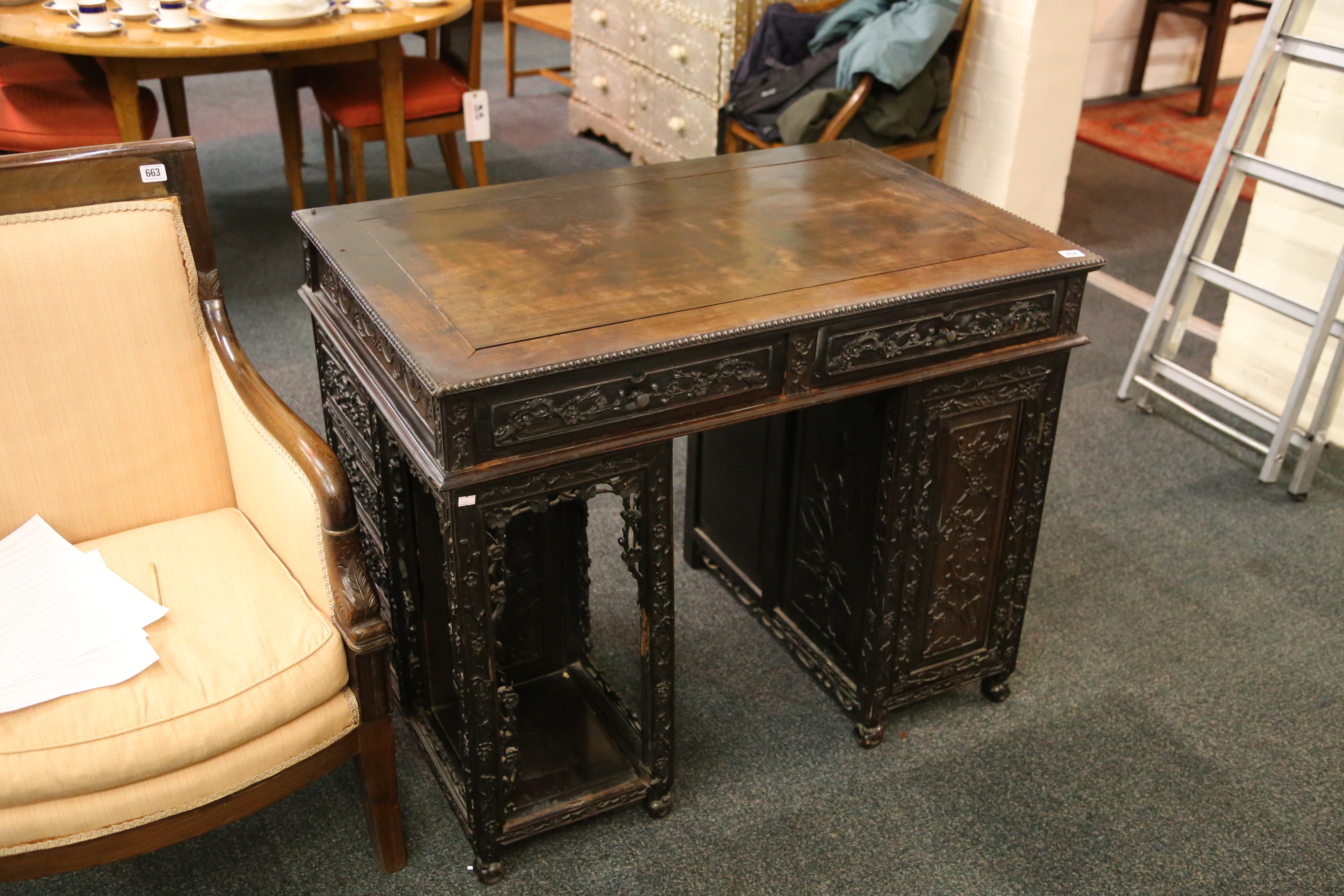 A Chinese padouk wood, twin pedestal desk, with an