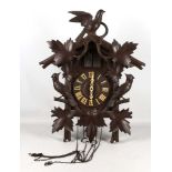 An oak, Black Forest style cuckoo clock, decorated