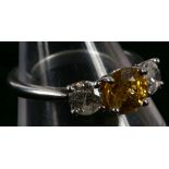 An 18ct white gold, yellow sapphire and diamond se
