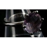 An 18ct white gold and amethyst solitaire ring, th