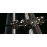 An 18ct white gold and diamond set five stone ring
