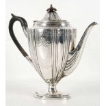 A Victorian silver coffee pot, reeded lid, leaf en