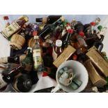 A large collection of spirit miniatures, including; Whisky, Rum, Brandy, Gin and associated figures,