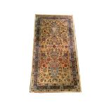 Persian Kirman rug, 1.12m x 0.59m, condition ratin